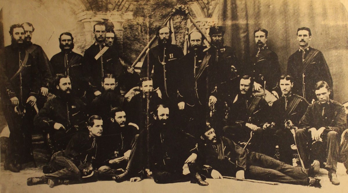 Group photo of around 25 officers in uniform.